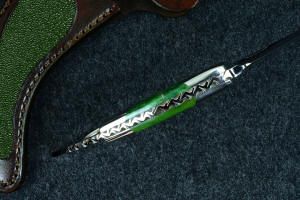 "Raptor" spine filework and thickness detail, noting complex filework and fullly tapered tang, with dovetailed fittings and gemstone scales